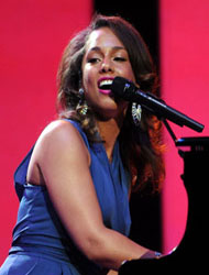 Alicia Keys singing and playing piano